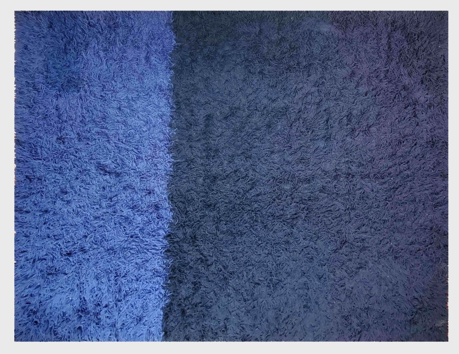 Close up detail shot of blue rug by Alain Richard.