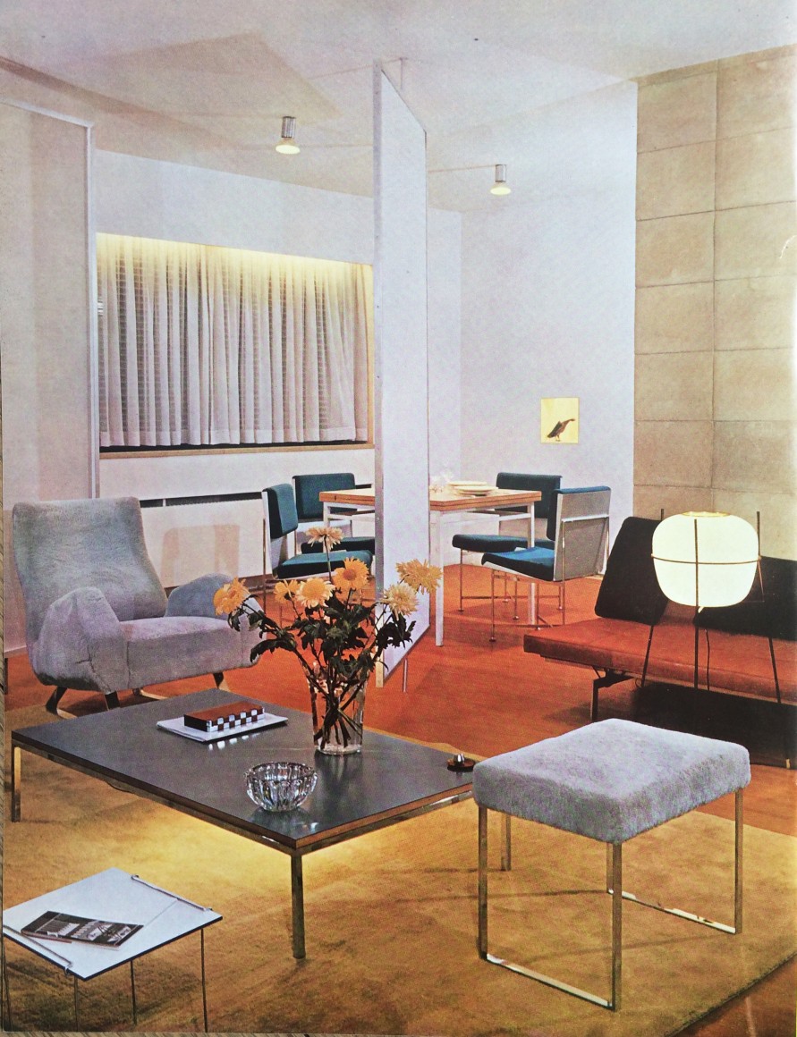 Archival photo of Jacques Dumond's apartment featuring upholstered chairs, couch, ottoman with metal legs alongside a metal table