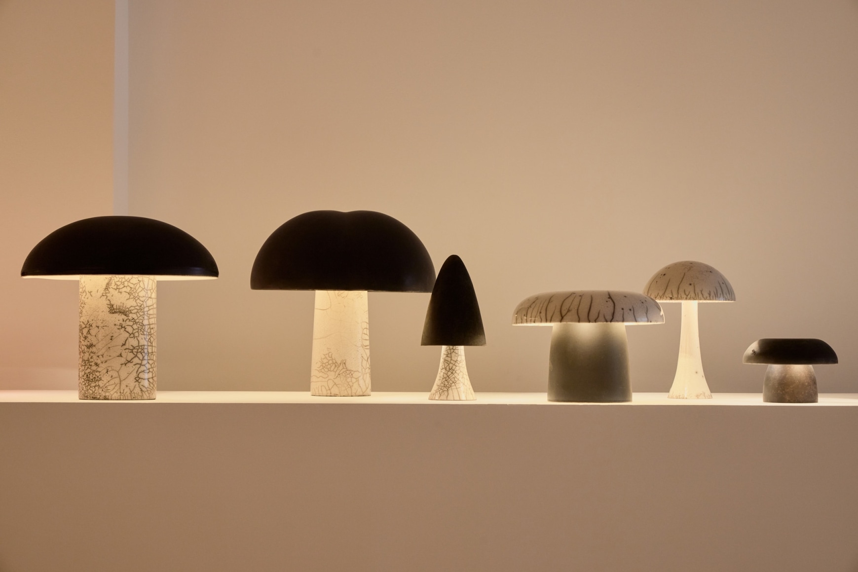 Grouping of various height lamps by Jos Devriendt