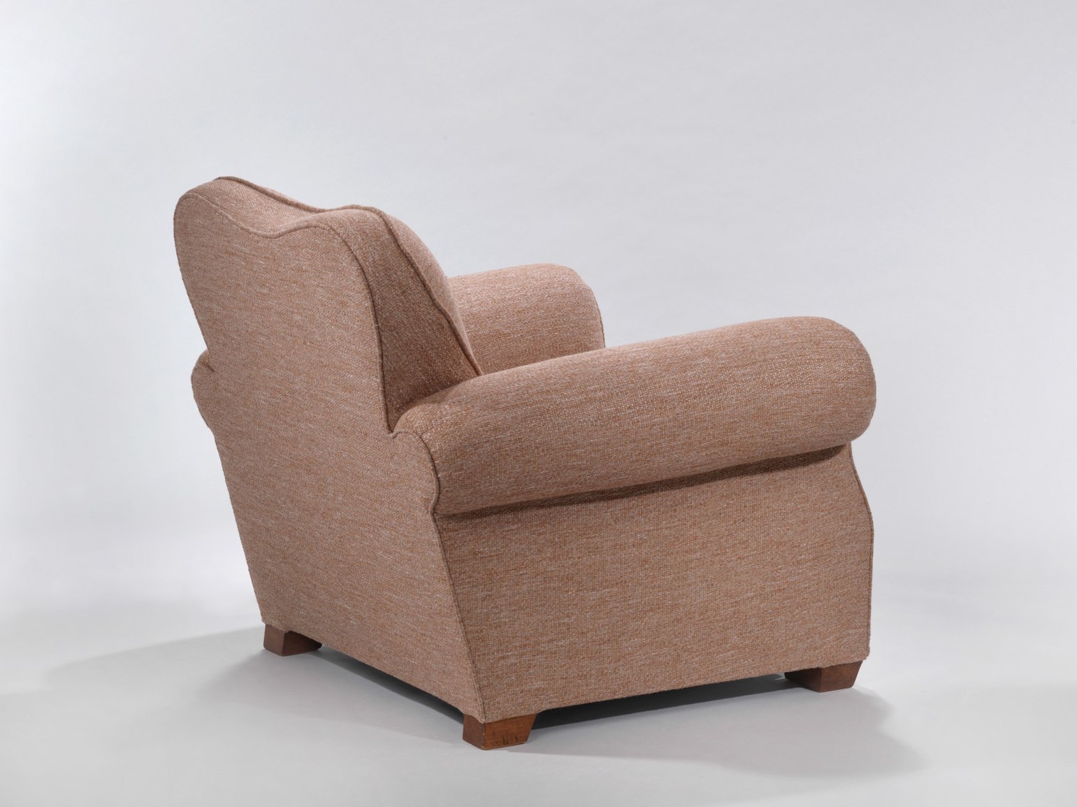 Back view of an upholstered armchair by Maxime Old