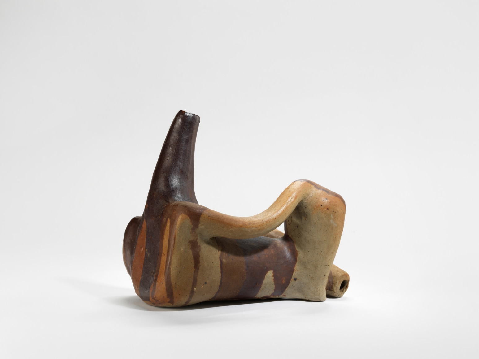 photograph of an anthropomorphic vase in an empty room
