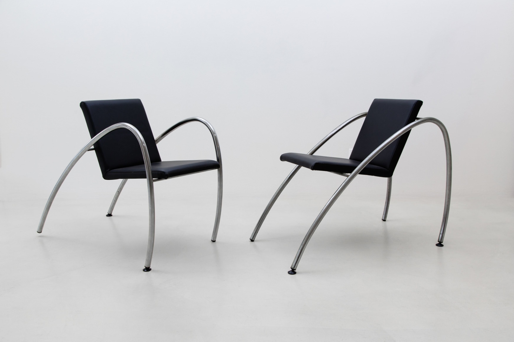 Black chairs with a white background