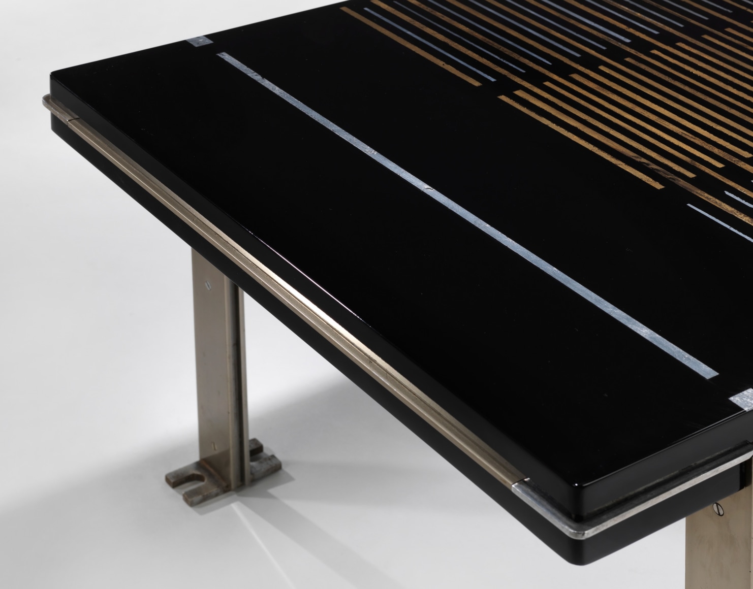 photograph of a black table in a blank room