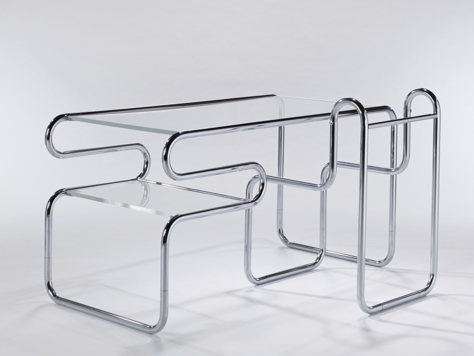 Back of chrome tubular glass topped desk with matching chair by Michel Hamon