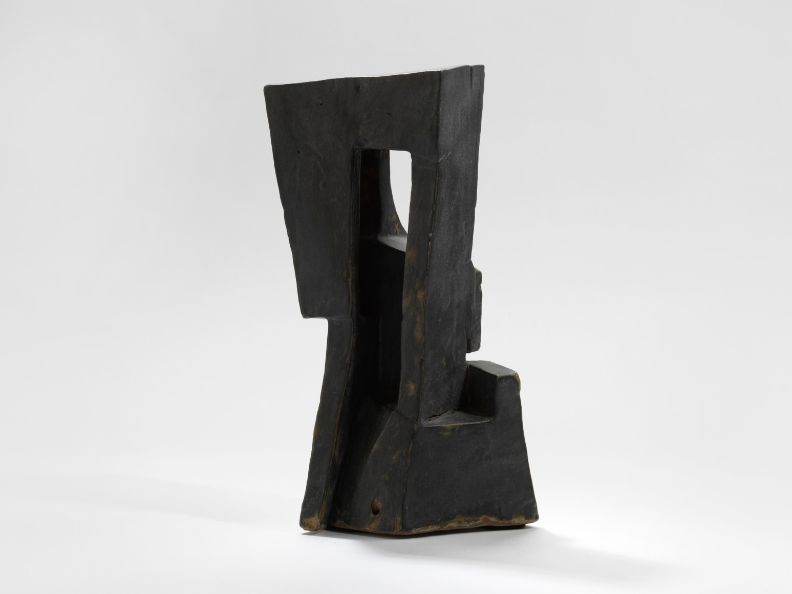 photo of geometric sculpture in a blank room