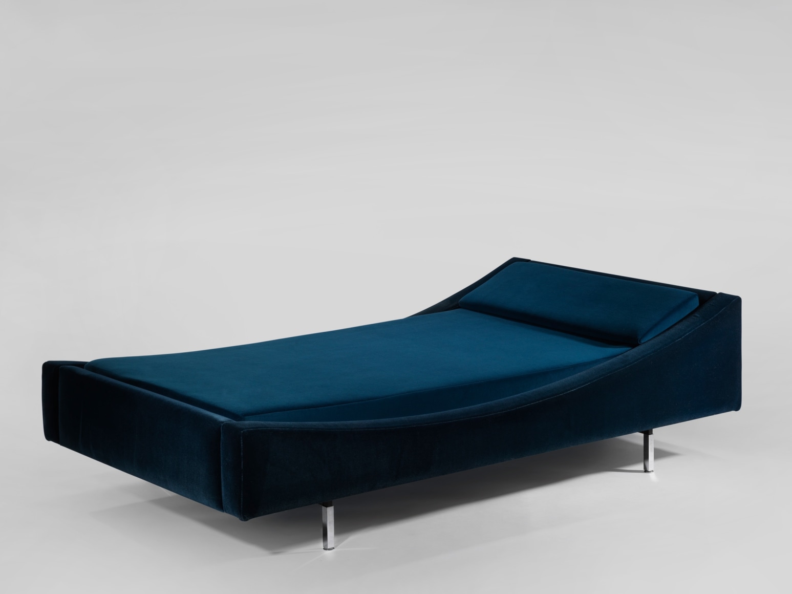 blue bed in an empty room