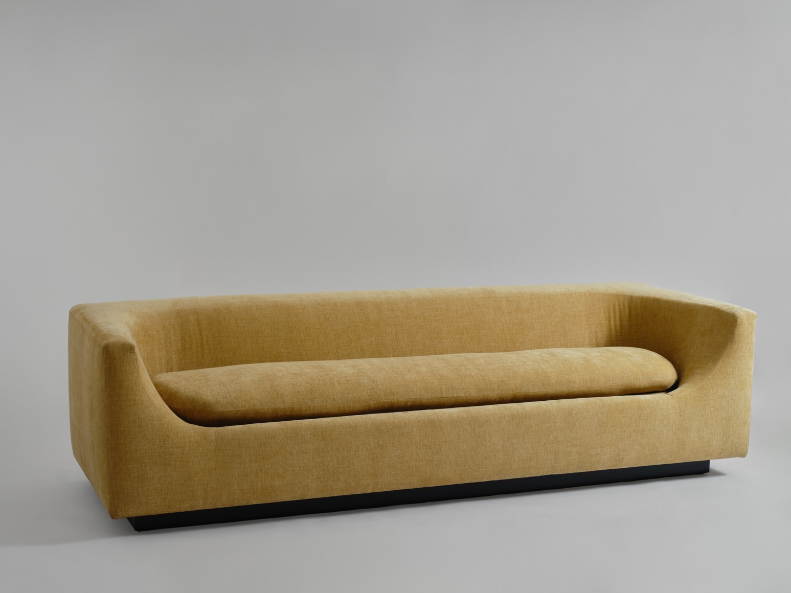 gold sofa in a gray room