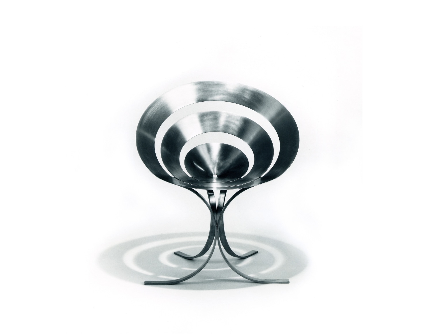 Metal cone-shaped chair with splayed legs