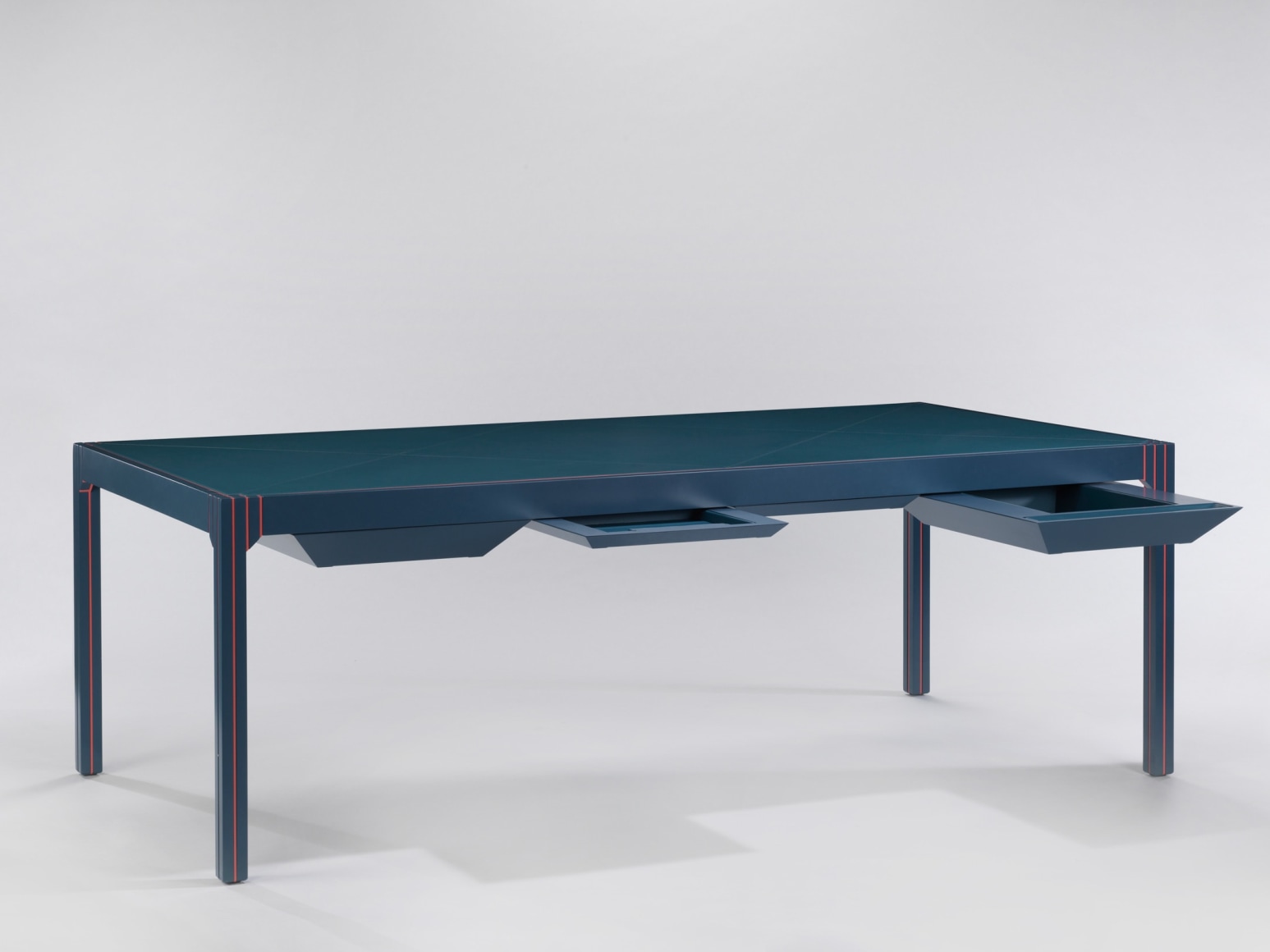 Blue lacquered desk with drawers open by Pierre Paulin