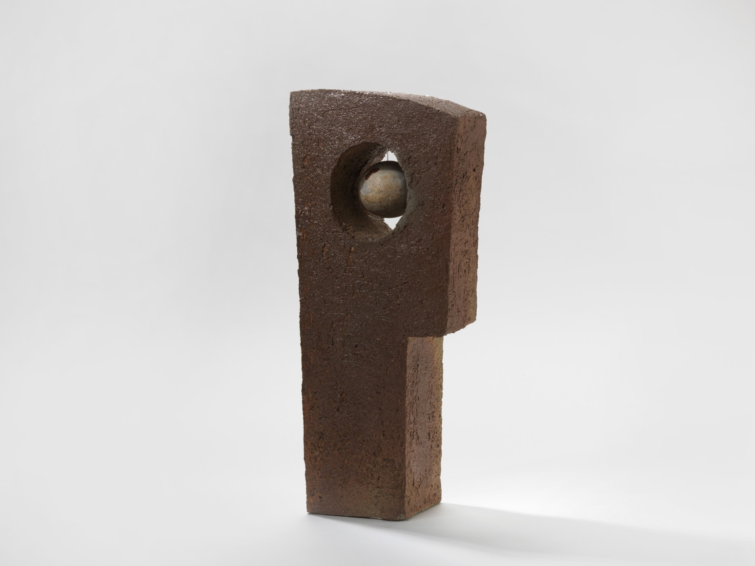 photograph of geometric sculpture in an empty room