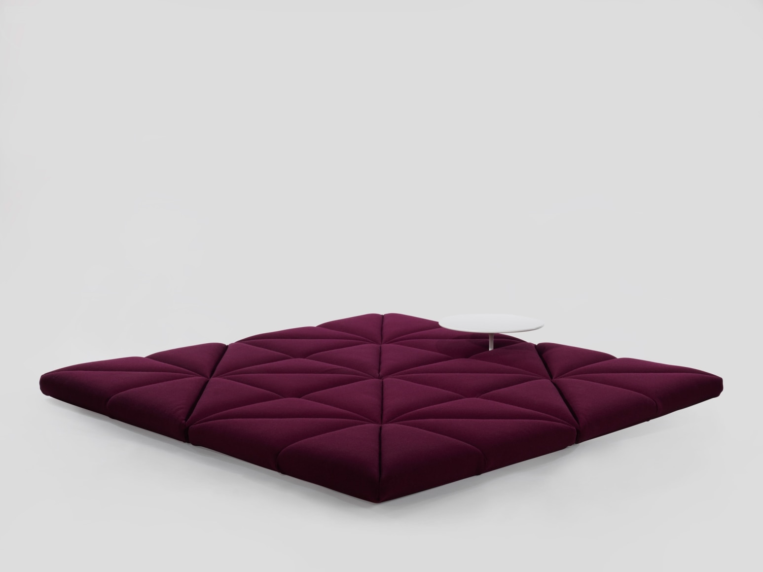 Upholstered modular sofa in flat position without base and table by Pierre Paulin