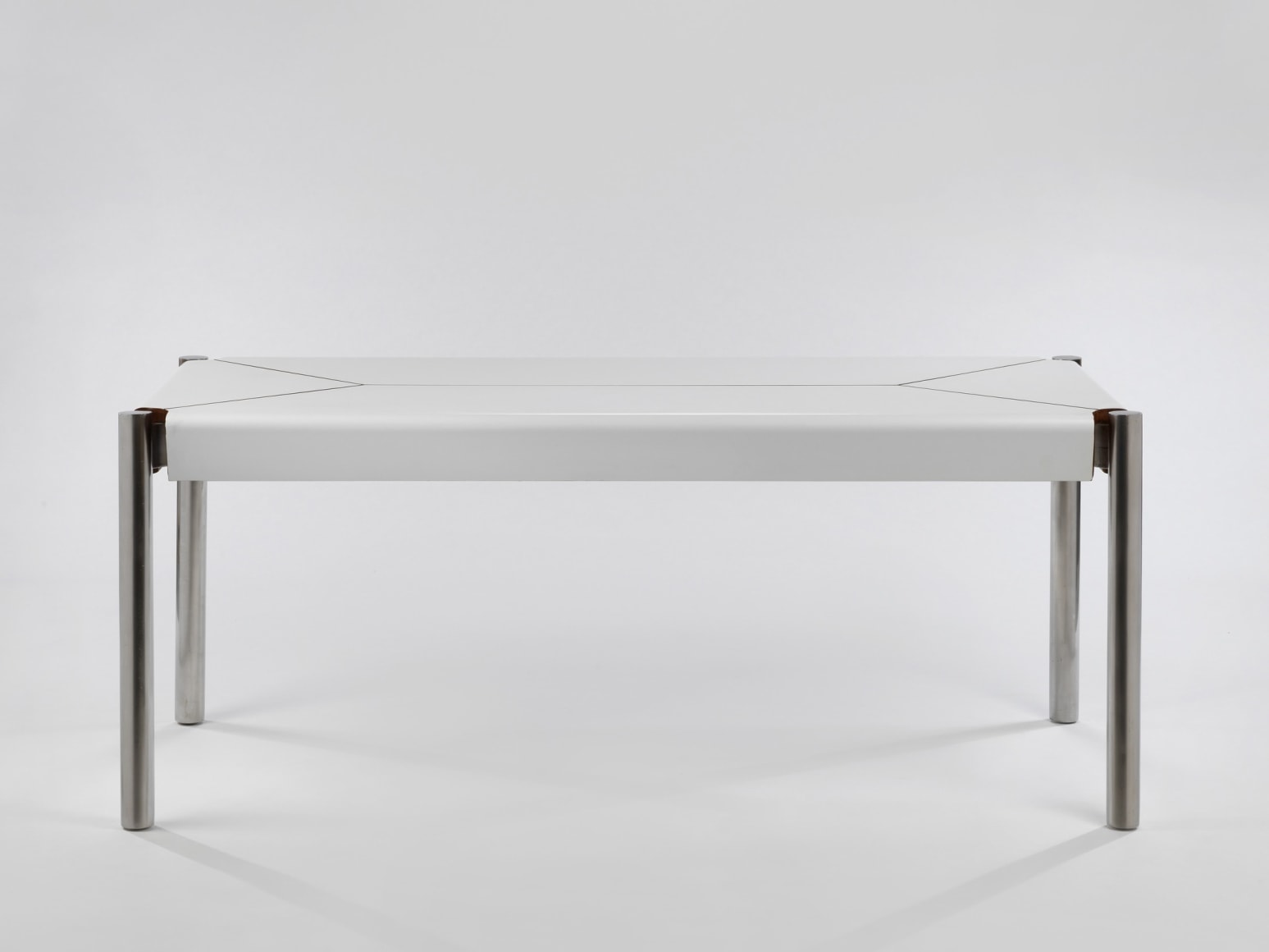 White formica table with stainless steel legs