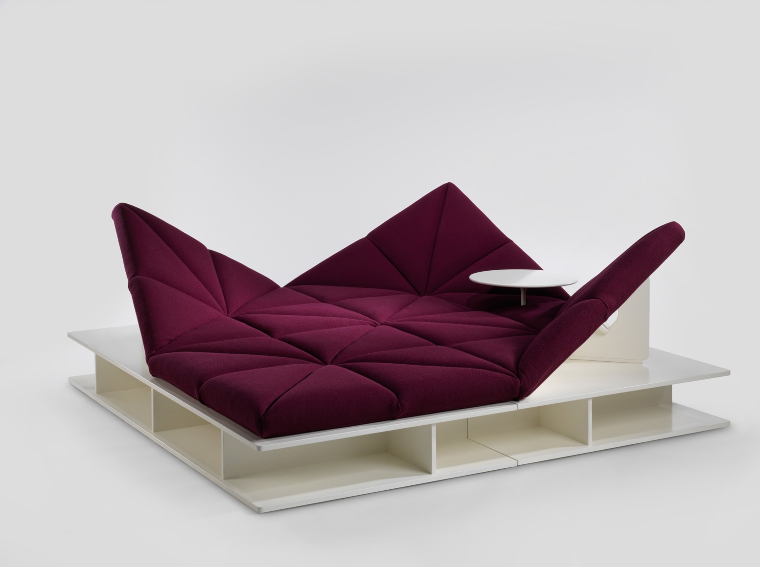 Upholstered modular sofa with removable base and table by Pierre Paulin