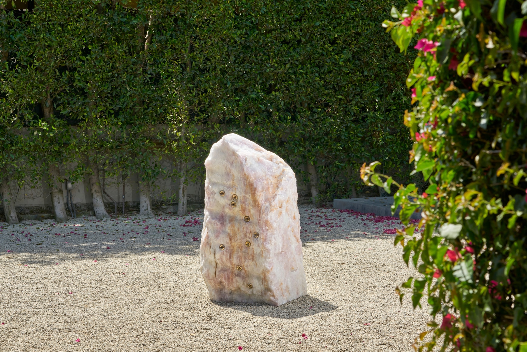 Installation view of Mika Tajima, Pranayama (Monolith, F, Rose Quartz), 2021, rock sculpture