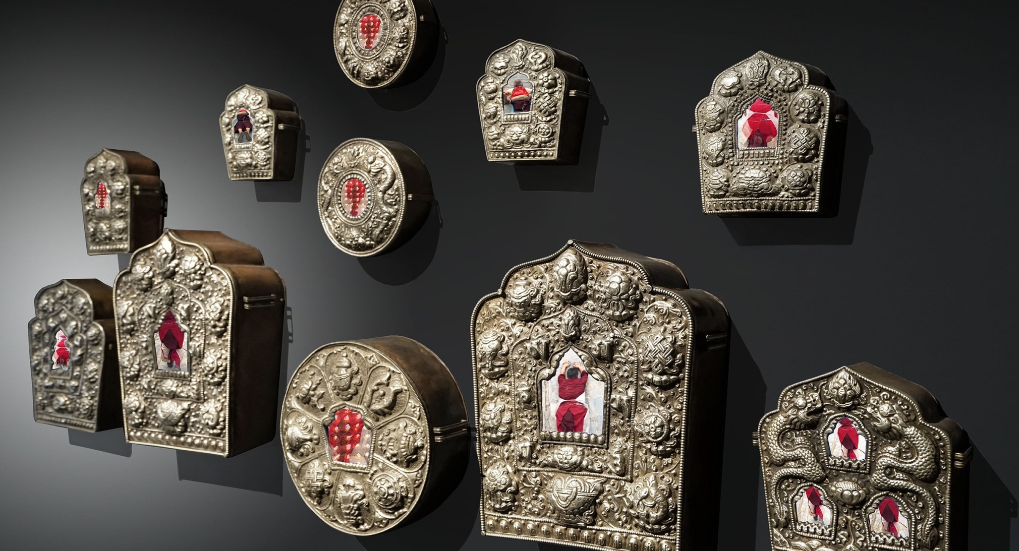 Make Me a Temple Within (The Ghau Series), 2019, portable vintage Buddhist shrines retrofitted with screens displaying video montages created by the artist, various dimensions (rectangular, square and round)