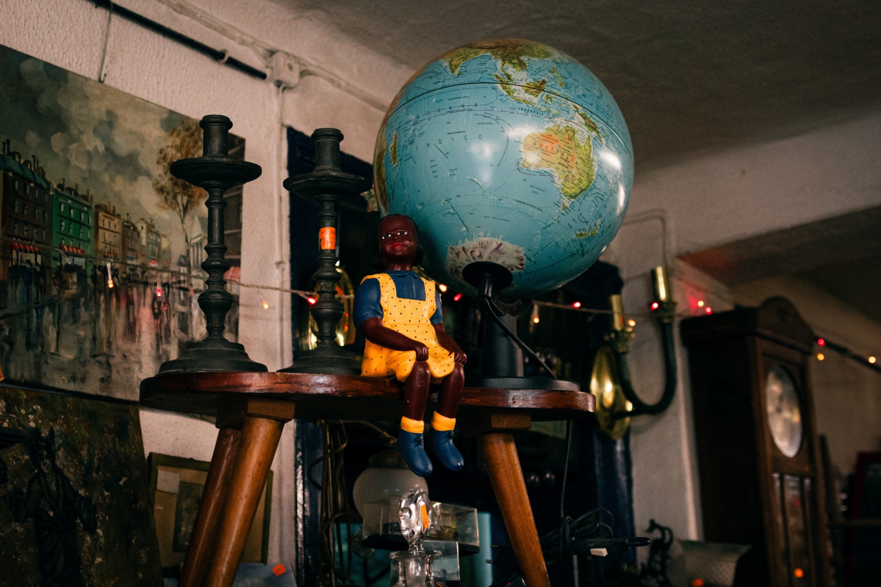 A detail of an antiques collection on the way to one of the homes she works for, featuring an Afro-descendant doll with the world on her back - it seemed to me like a metaphor for Ana Maria Jeremias' life. Lisbon, Portugal, 2024
