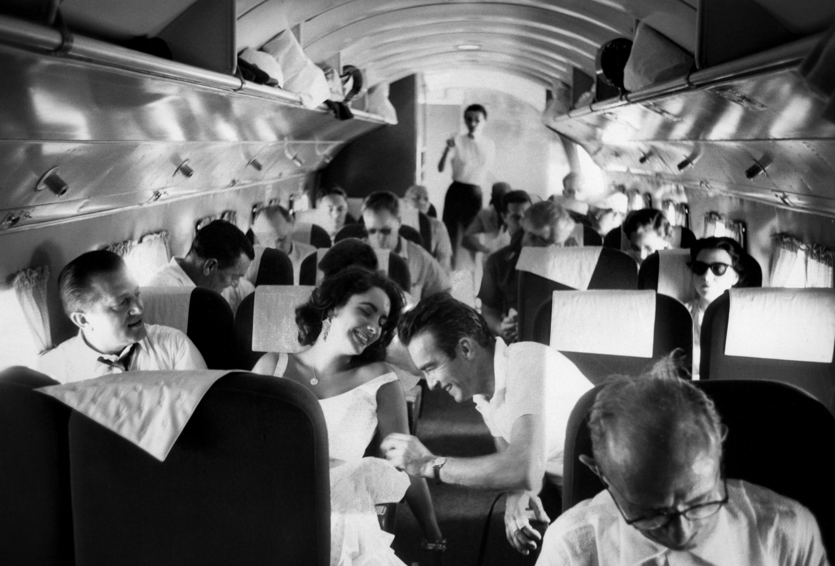 Elizabeth Taylor and Montgomery Clift share a laugh on the way to the Natchez Mississippi location for "Raintree County", 1956, Archival Pigment Print