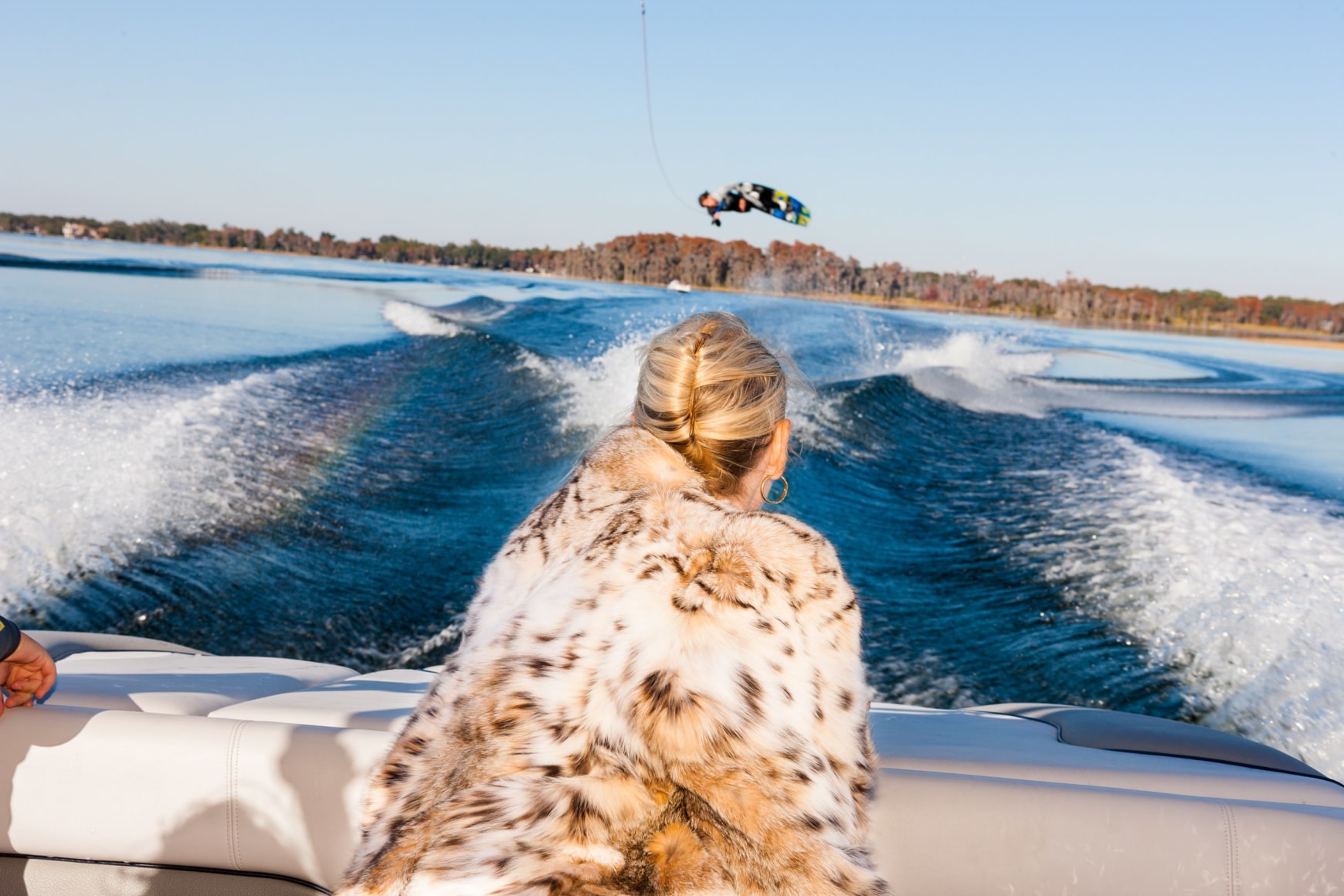 Jackie watches Trevor Hansen, 25, a professional wakeboarder, from a friend’s boat, Windermere, Florida, 2010, Archival Pigment Print