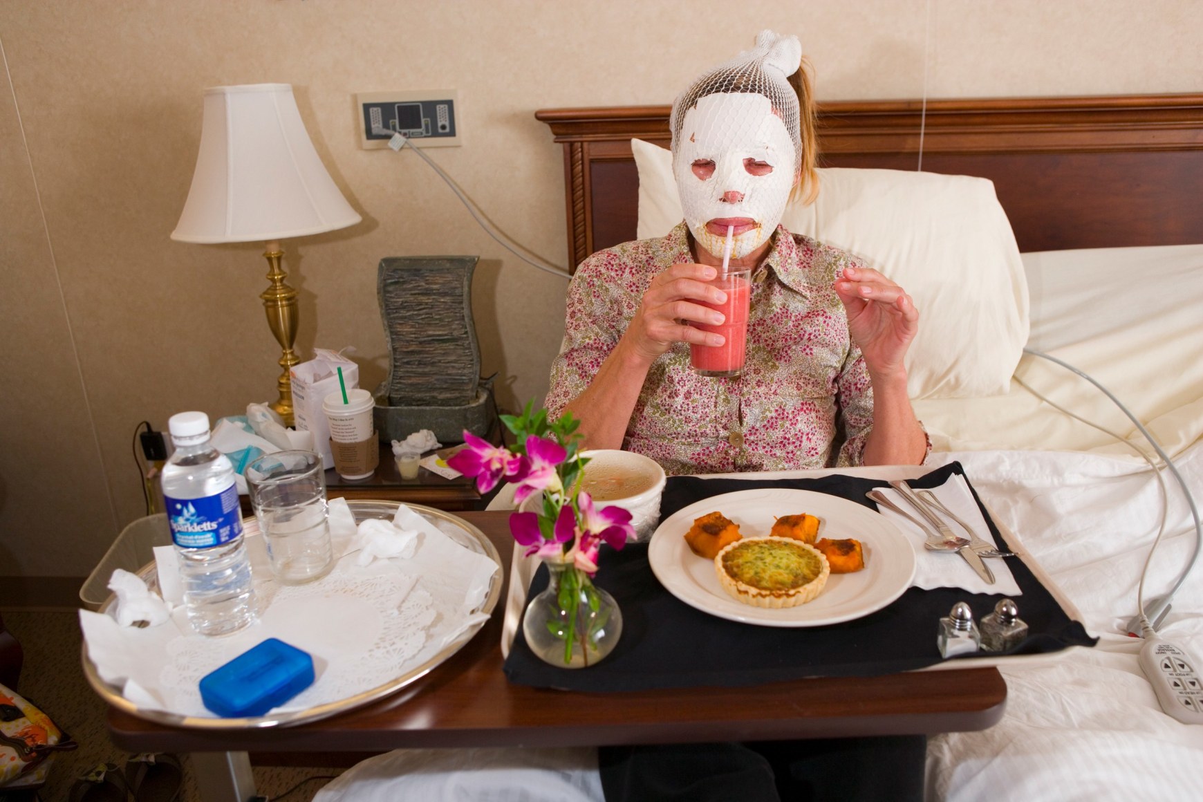 Dr. Steven Teitelbaum’s forty-nine-year-old patient, who is recovering from a full-face laser resurfacing and an upper eye lift, eats lunch in a private room at Serenity, a luxury aftercare facility that offers private chefs, spa treatments, and twenty- four-hour nursing, Santa Monica, California, 2006, Archival Pigment Print