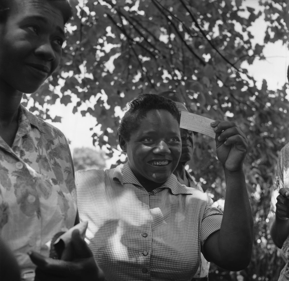 Reecie Hunter Malone displaying her voter registration card, Fayette County, n.d., Archival Pigment Print