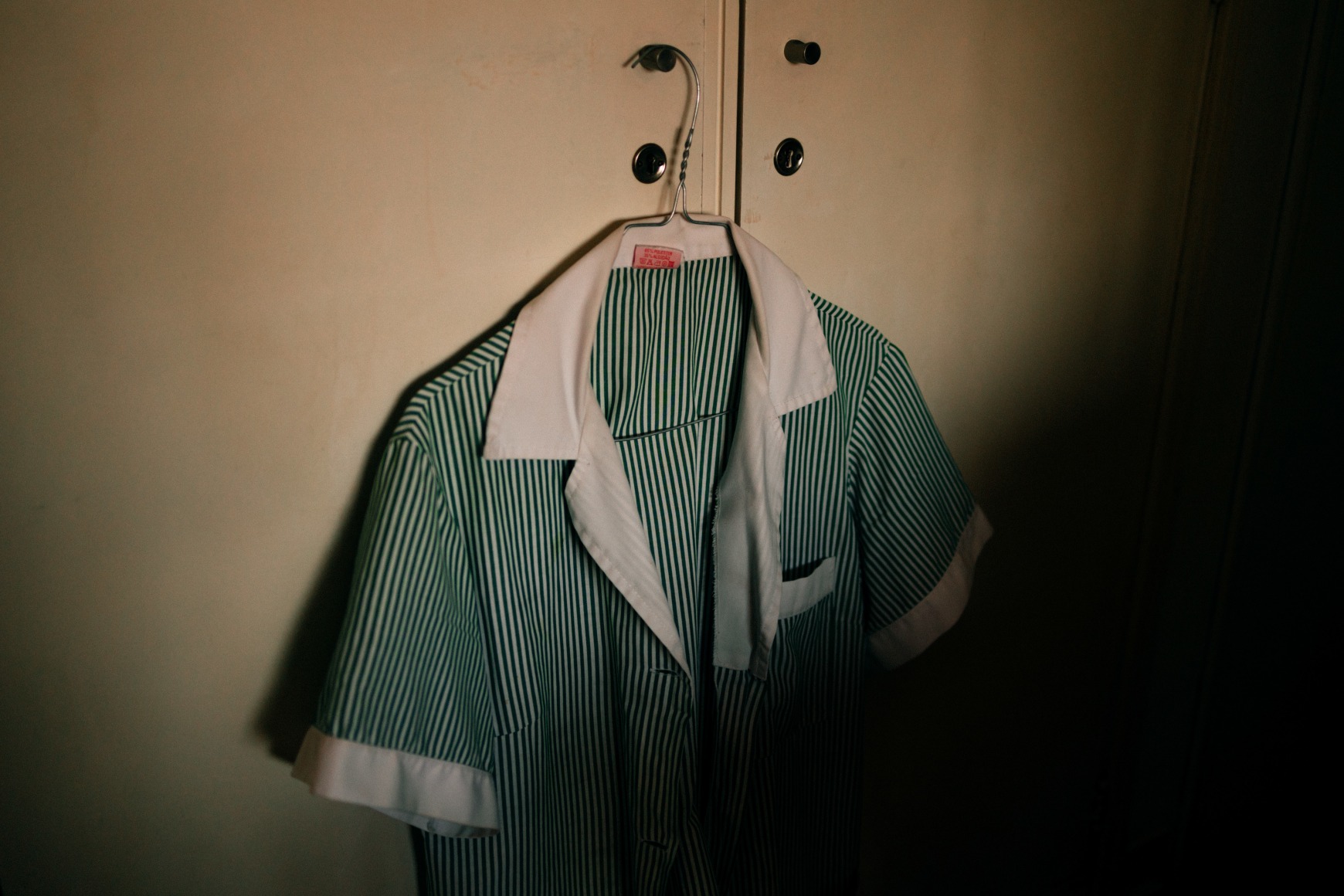 Ana Maria Jeremias' domestic worker uniform. Lisbon, Portugal, 2024