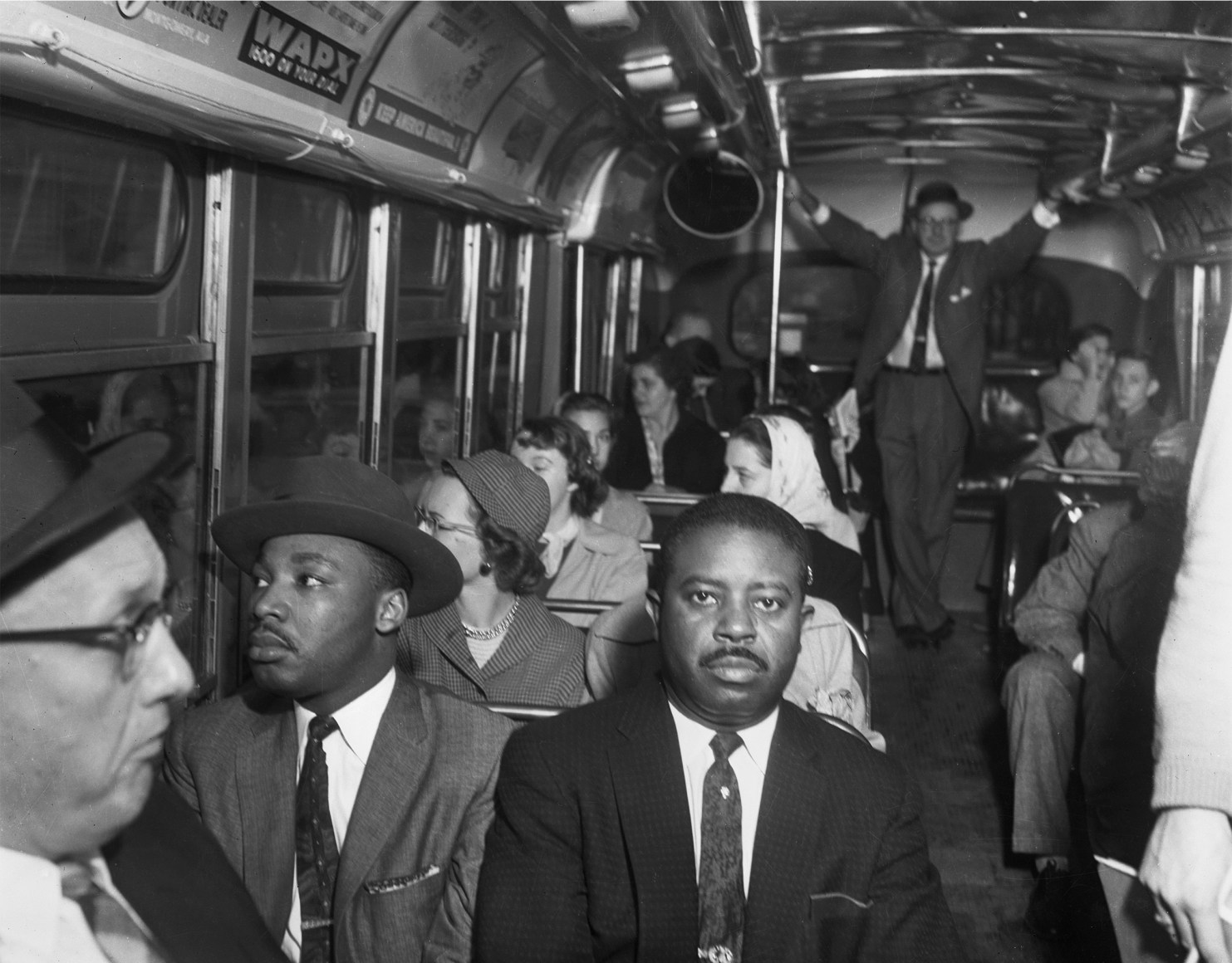 Martin Luther King Jr. and Ralph Abernathy in the front row of a Montgomery, Alabama bus on the day that the city's public transit system was desegregated, n.d., Archival Pigment Print