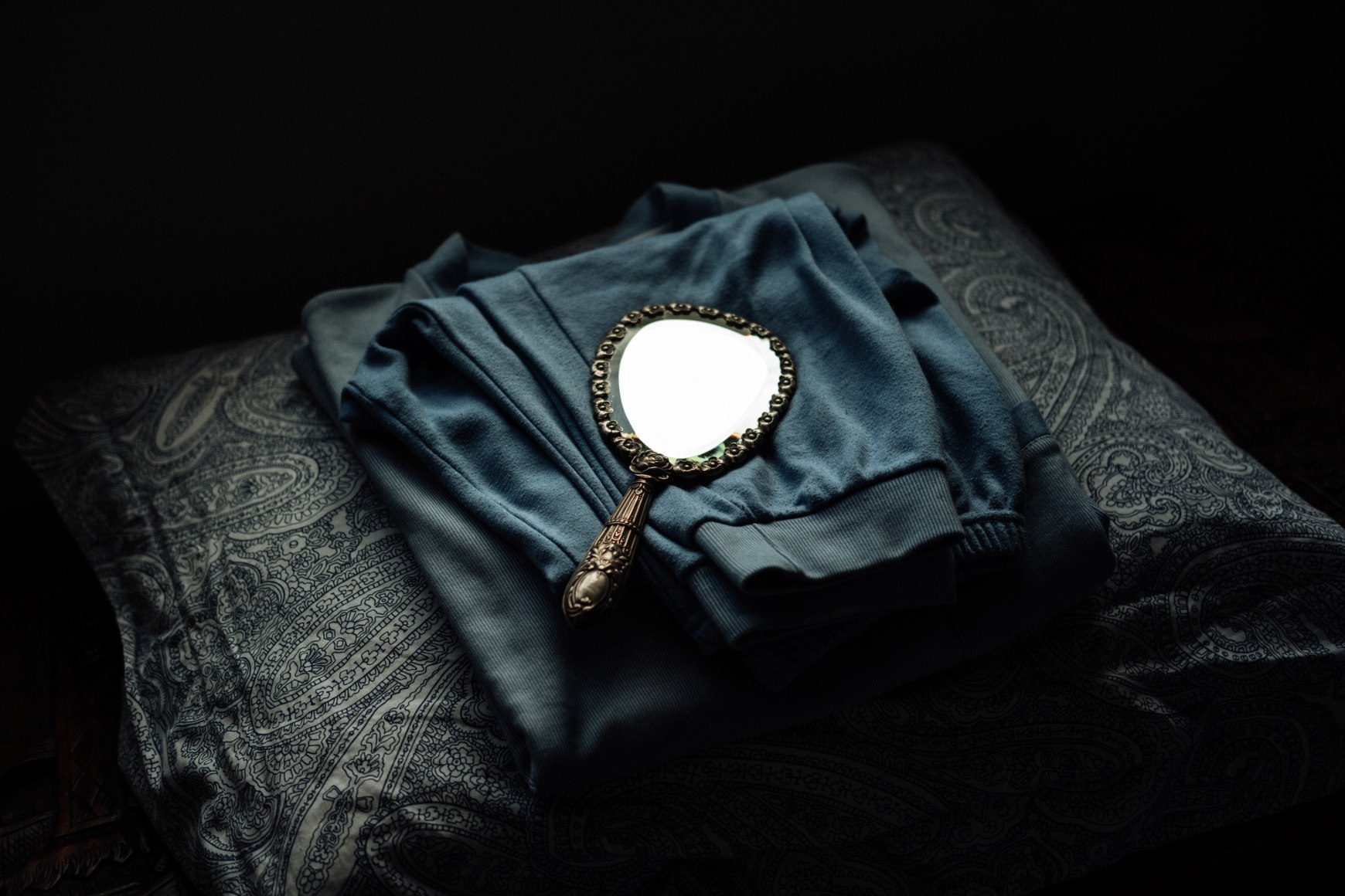 The folded pajamas of Mr. Orlando, one of Ana Maria Jeremias's employers, who had recently lost his wife. Lisbon, Portugal, 2024