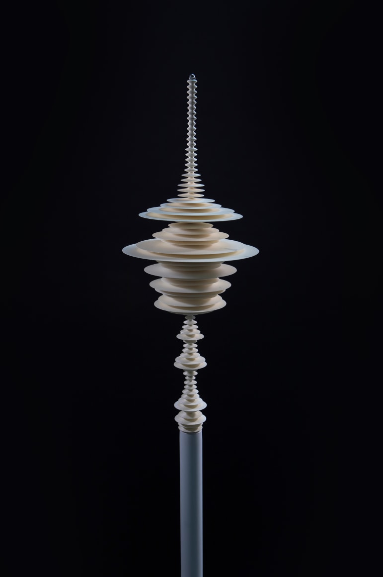 a sculpture by Elizabeth Turk of 3D-printed discs layered and arranged to resemble a sound wave and a modernist abstraction