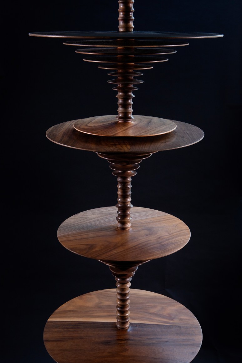 a sculpture by Elizabeth Turk of wood discs layered and arranged to resemble a Modernist abstraction and a sound wave