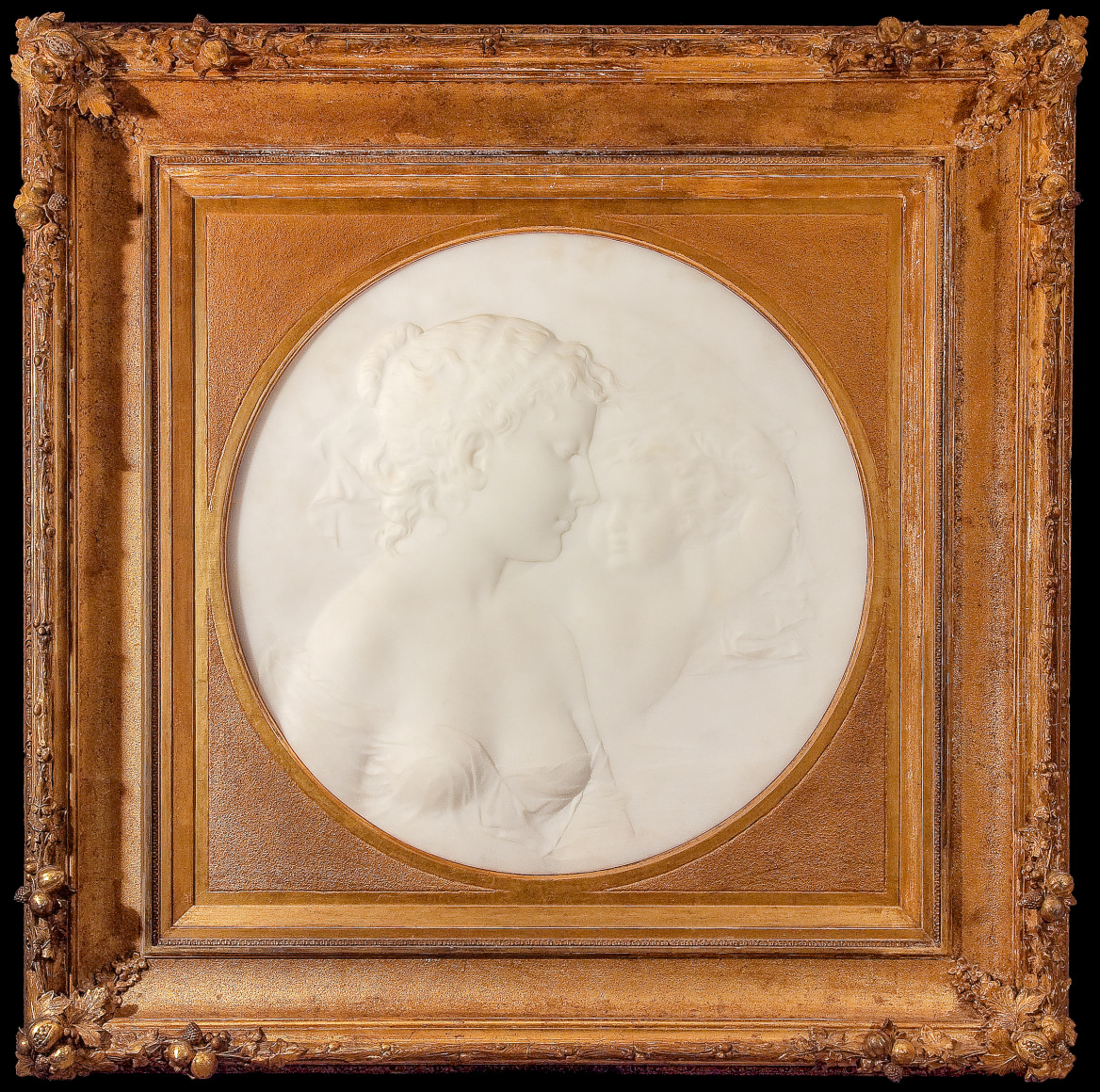THOMAS BALL (1819&ndash;1911), &quot;Whispering Zephyr,&quot; c. 1884. Marble relief, 20 in. diameter. Showing 19th-century gilded cove frame.