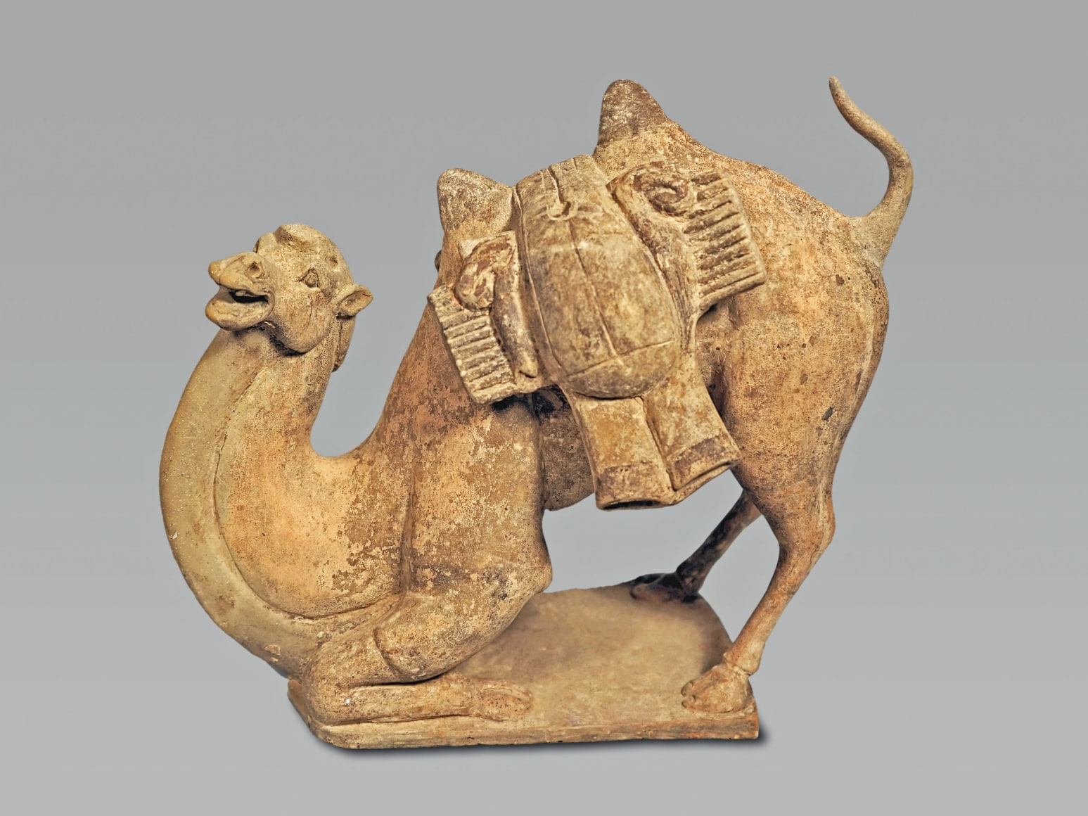 Chinese Unglazed Pottery Figure of a Kneeling Camel