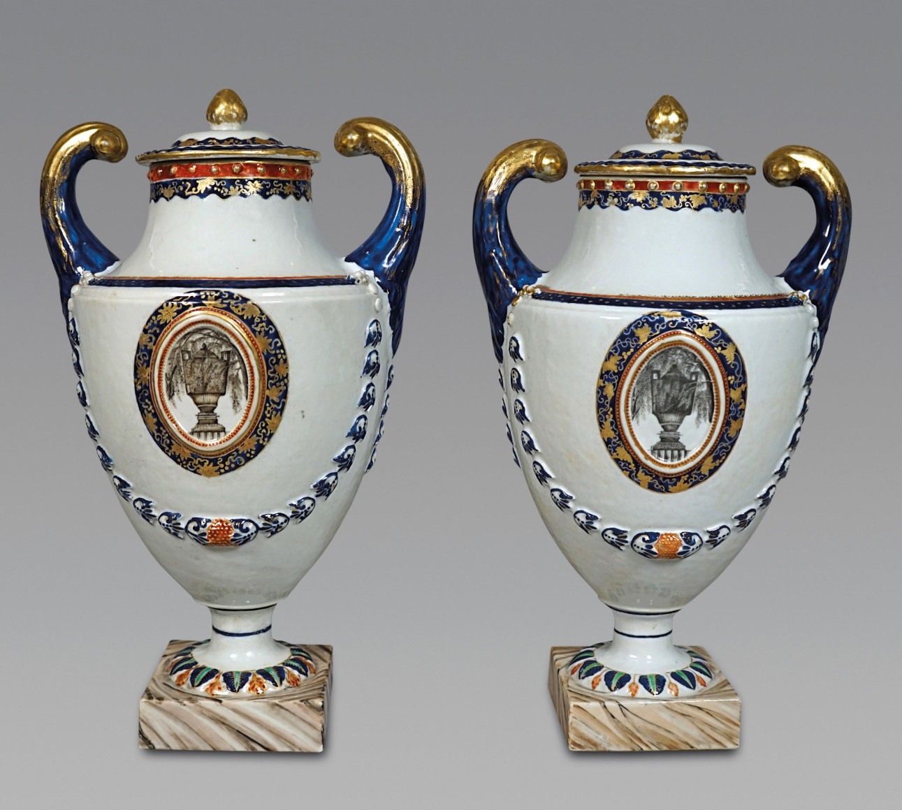 Pair of Chinese Export “Urne Mysterieuse” Pistol Handled Vases and Covers