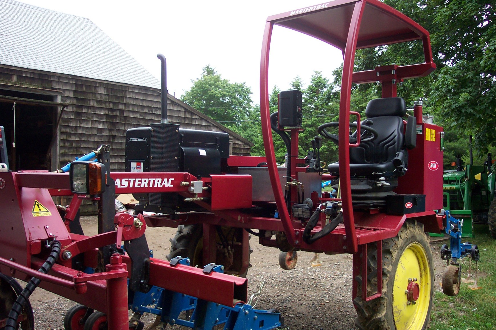 We control weeds by mechanical means. This cultivating tractor does a terrific job of eliminating weeds in our row crops, but our crew usually follows up to keep the fields weed free. As we work our fields, we find the weed pressure reduces after several years of careful stewardship.