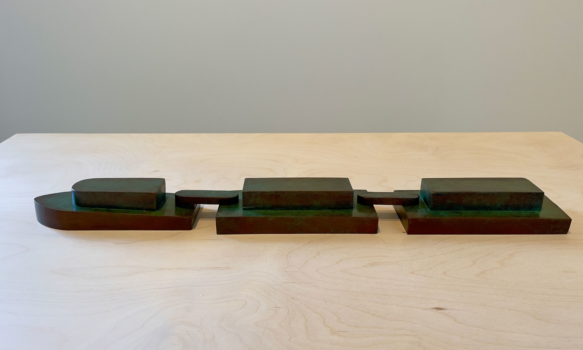 Tom Ashcraft  Dothan, 2022  Bronze, 1 3/4h x 22 3/4w x 3 1/4d in, cast bronze sculpture modeled after a carved wooden toy boat