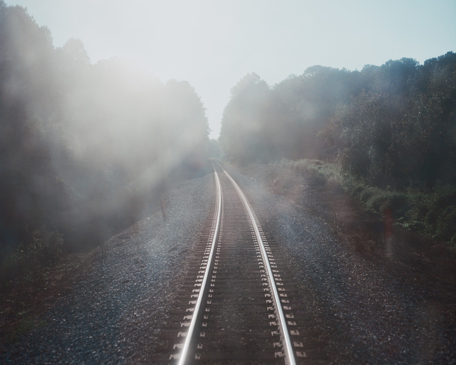 Landscape of train tracks, by McNair Evans