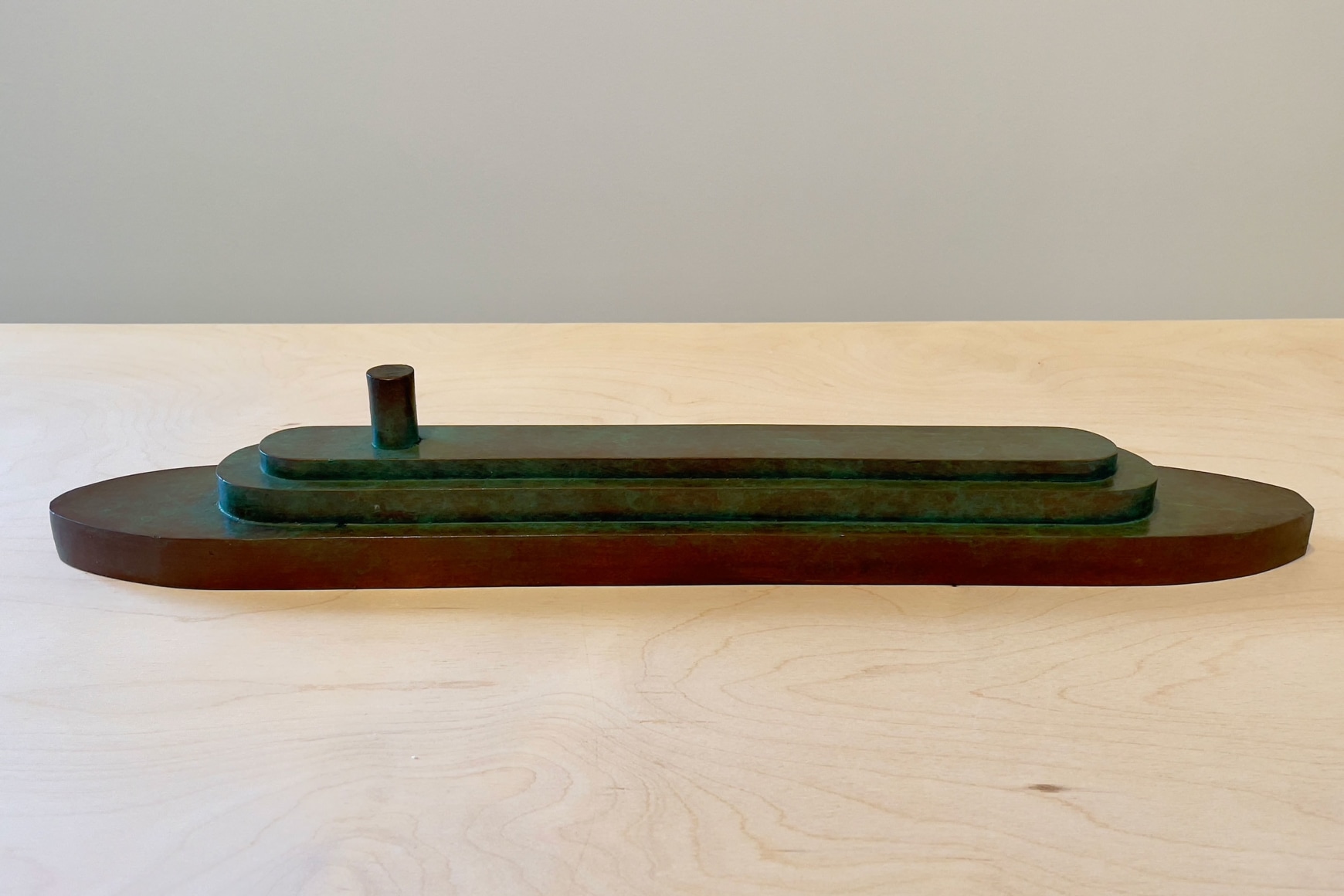 Tom Ashcraft  Juniper, 2022  Bronze  3 1/8h x 21w x 1d in, cast bronze sculpture modeled after a carved wooden toy boat