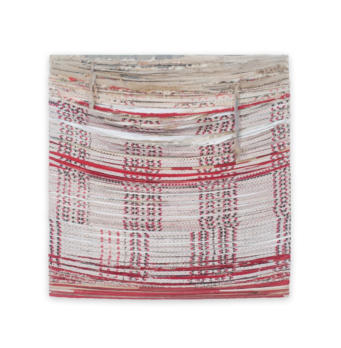 Deconstructed woven textile that is draped and stretched horizontally.