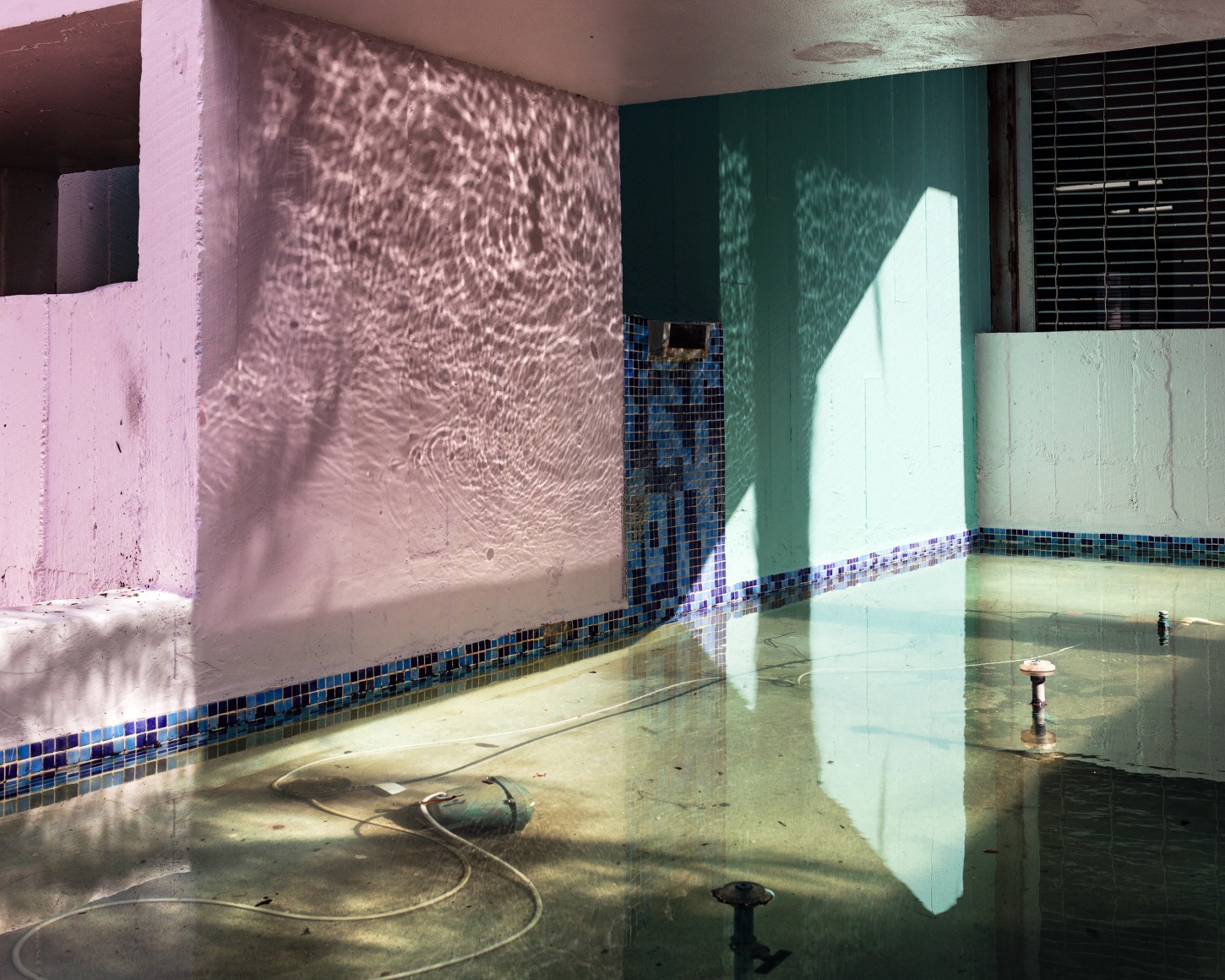 Fountain, 2017  Archival pigment print  40 x 50 inches  Edition of 5, from the series Flood Zone, Pink and blue walls with a water reflection