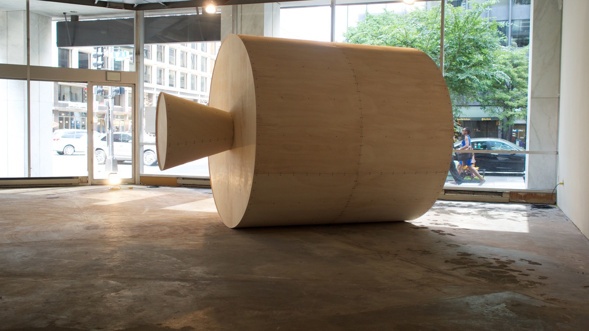 Sculptural installation of large bottle shape