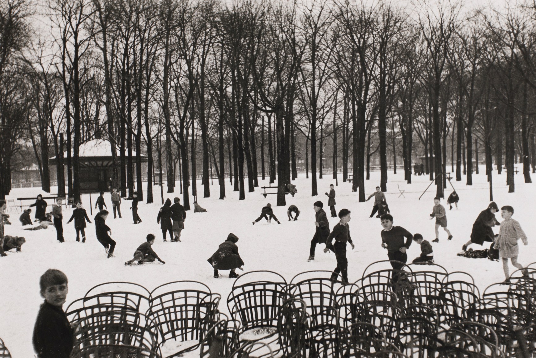 Edouard Boubat (1923-1999)  Enfants dans le Premiere Neige, 1953, printed later  Gelatin silver print  9 1/2h x 14 1/4w in 24.13h x 36.20w cm, Black and White Photography