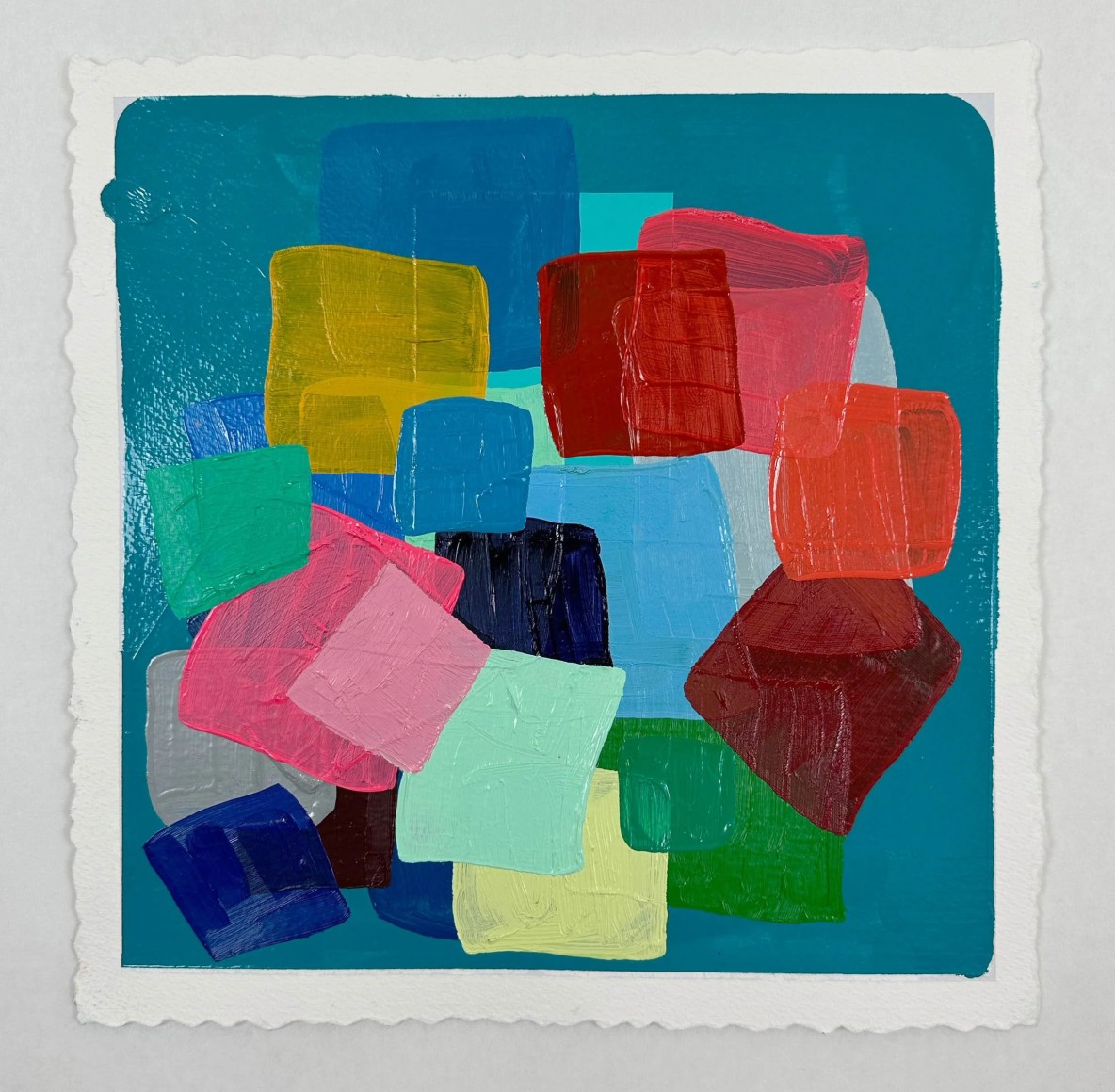 abstract work on paper with a series of colorful blocked stacked and overlapped one another