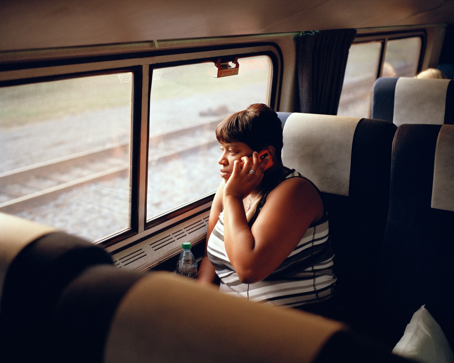 Person on train on cell phone