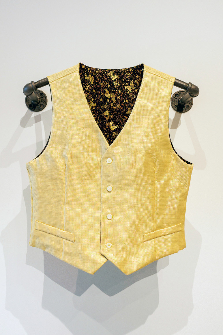 Yellow Kevlar vest with black and gold butterfly lining. This vest is tailor-made to fit and protect Shell, a professional ballet dancer and close family friend, especially during my teenage years. The butterfly patterned lining reflects the ways in which he has overcome obstacles to reinvent himself and his career.