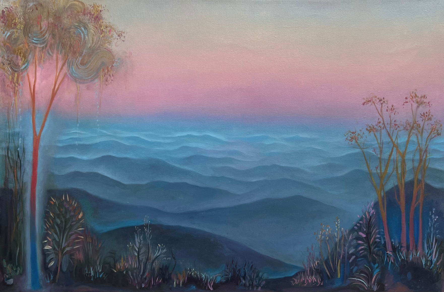 a rose glow landscape of rolling mountains