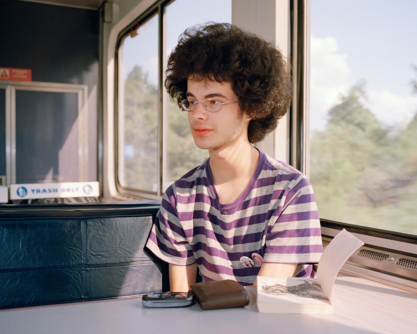 Person on train with book