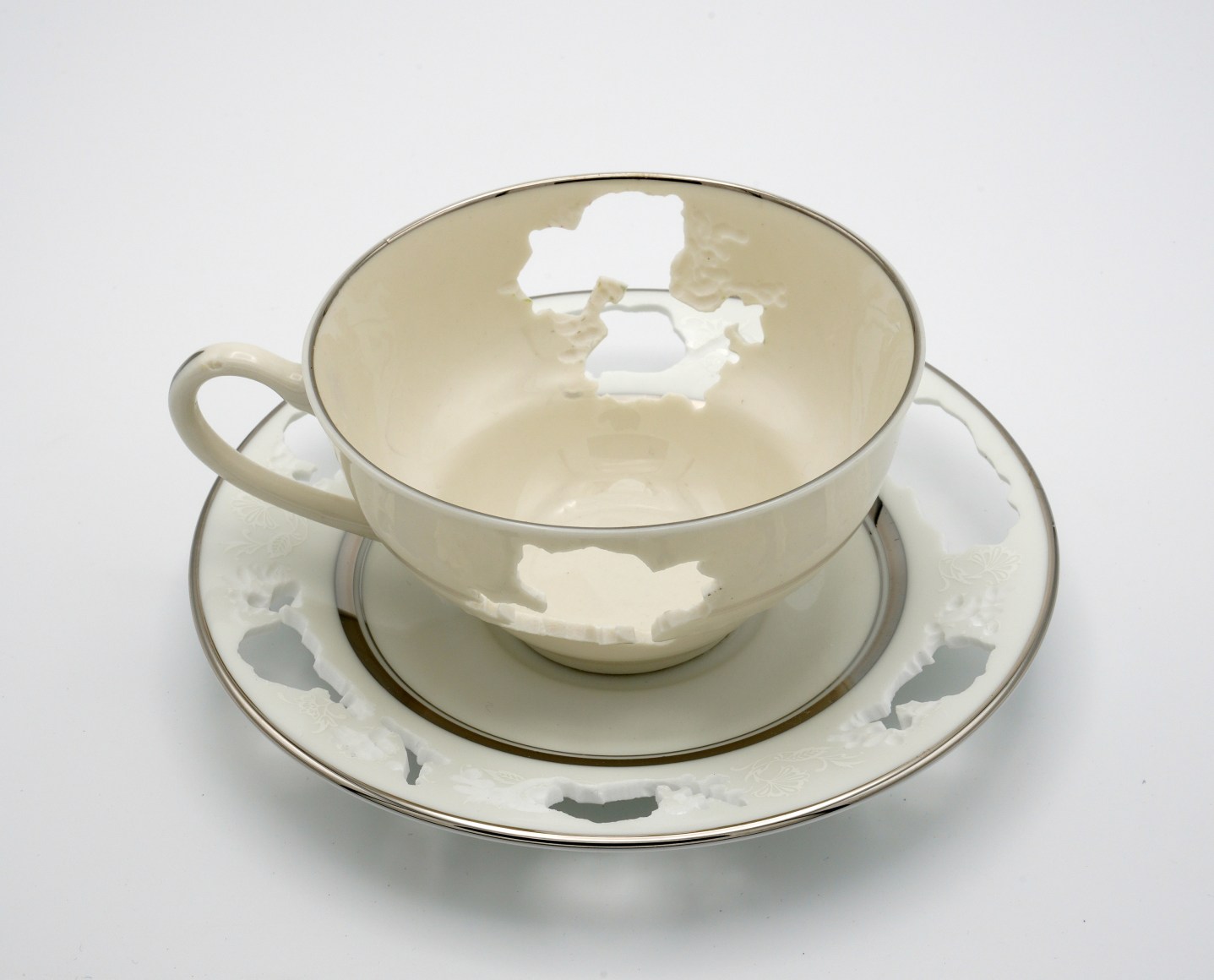 Heirloom tea cup and saucer with hand cut details removed