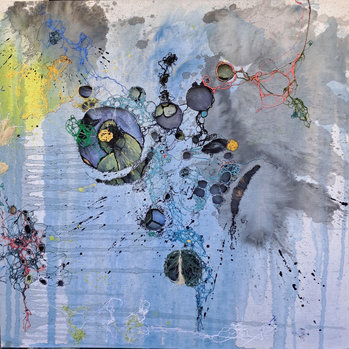 abstract painting with washes of blue and grey embroidered with bright colored thread, repaired/embroidered holes