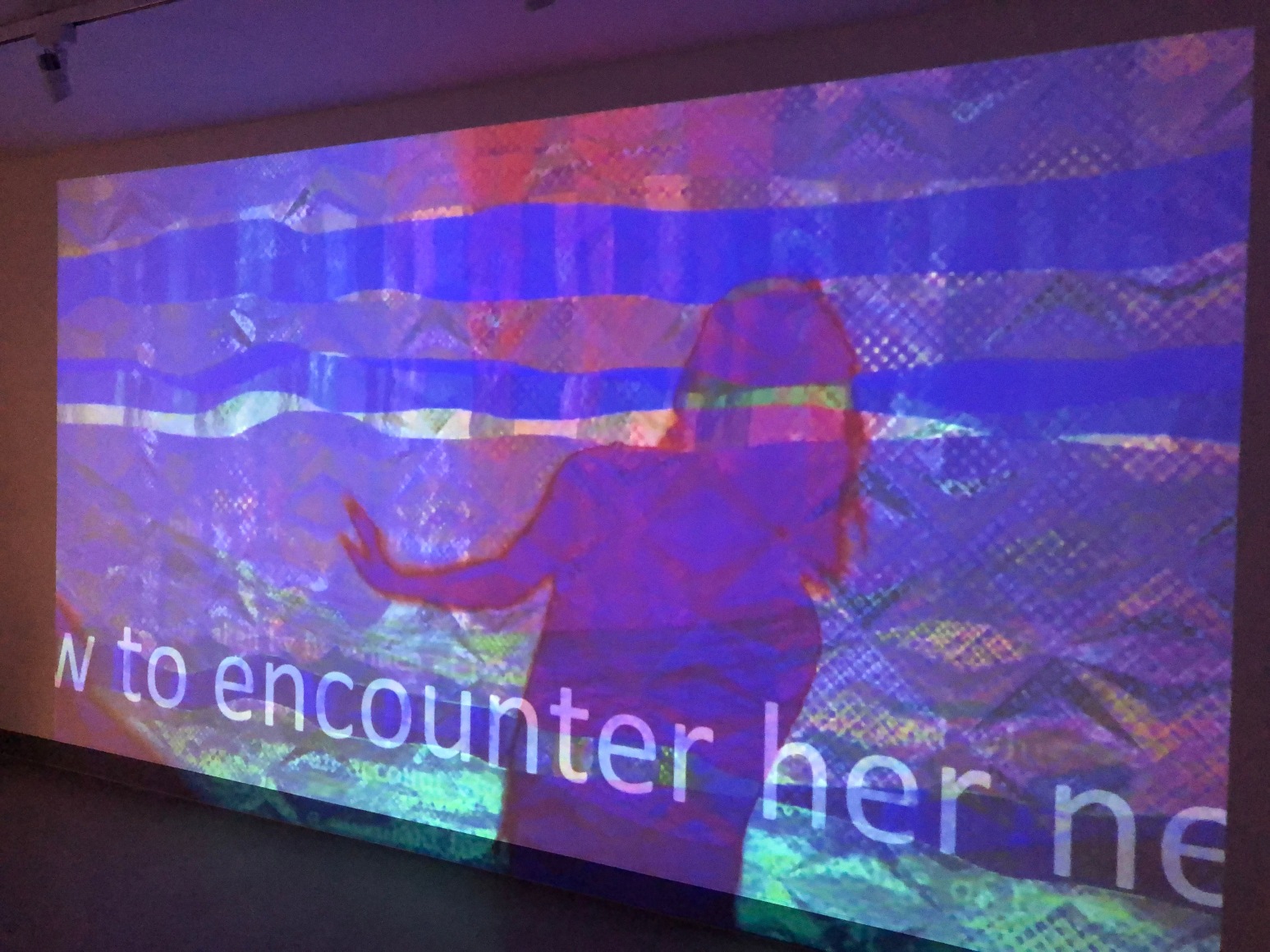 A little mermaid swimming in a sea of blue and purple