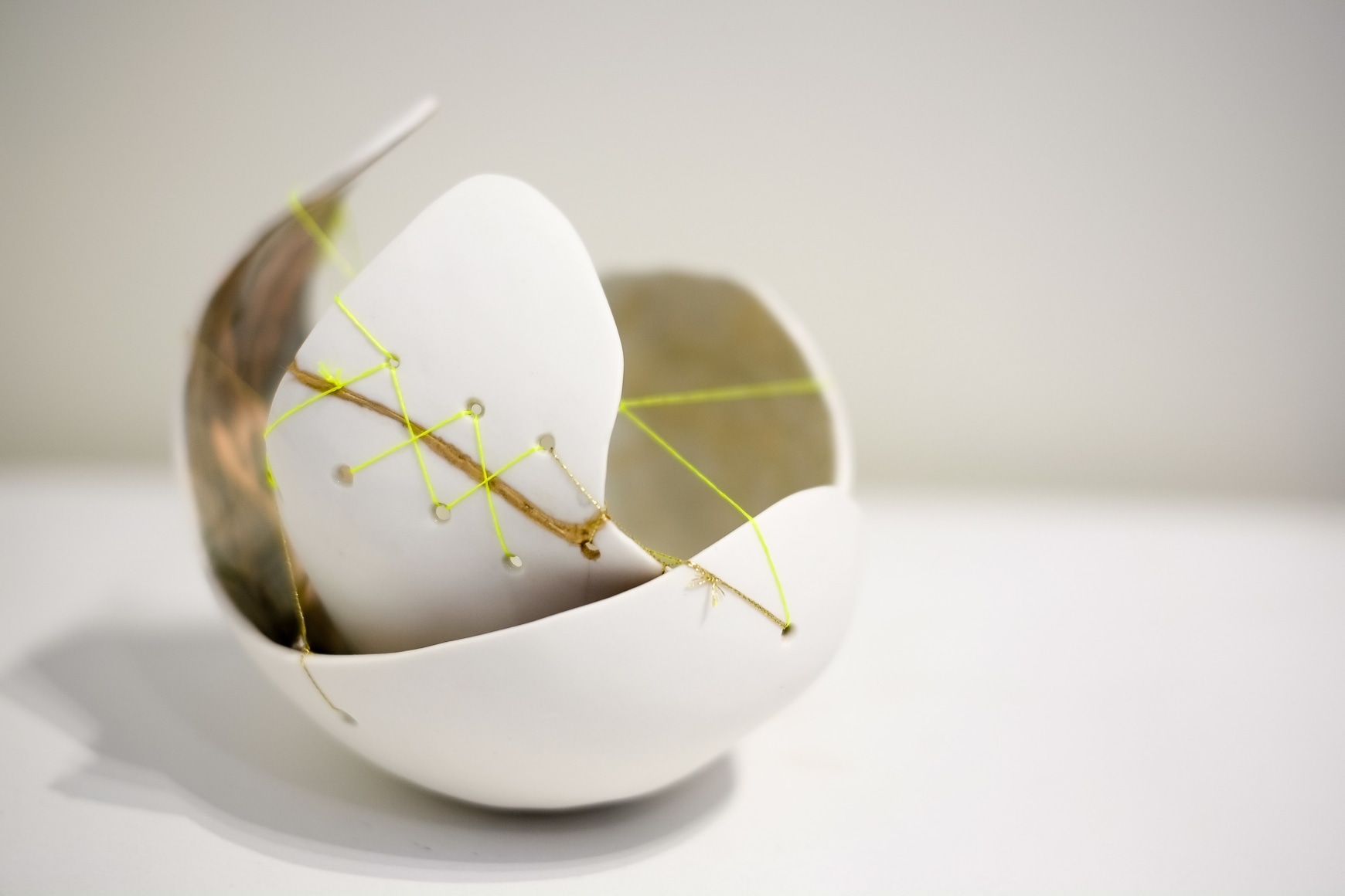 Amanda Humphries, Hug (2 pieces stitched together),  porcelain with kinsugi technique and thread 2018