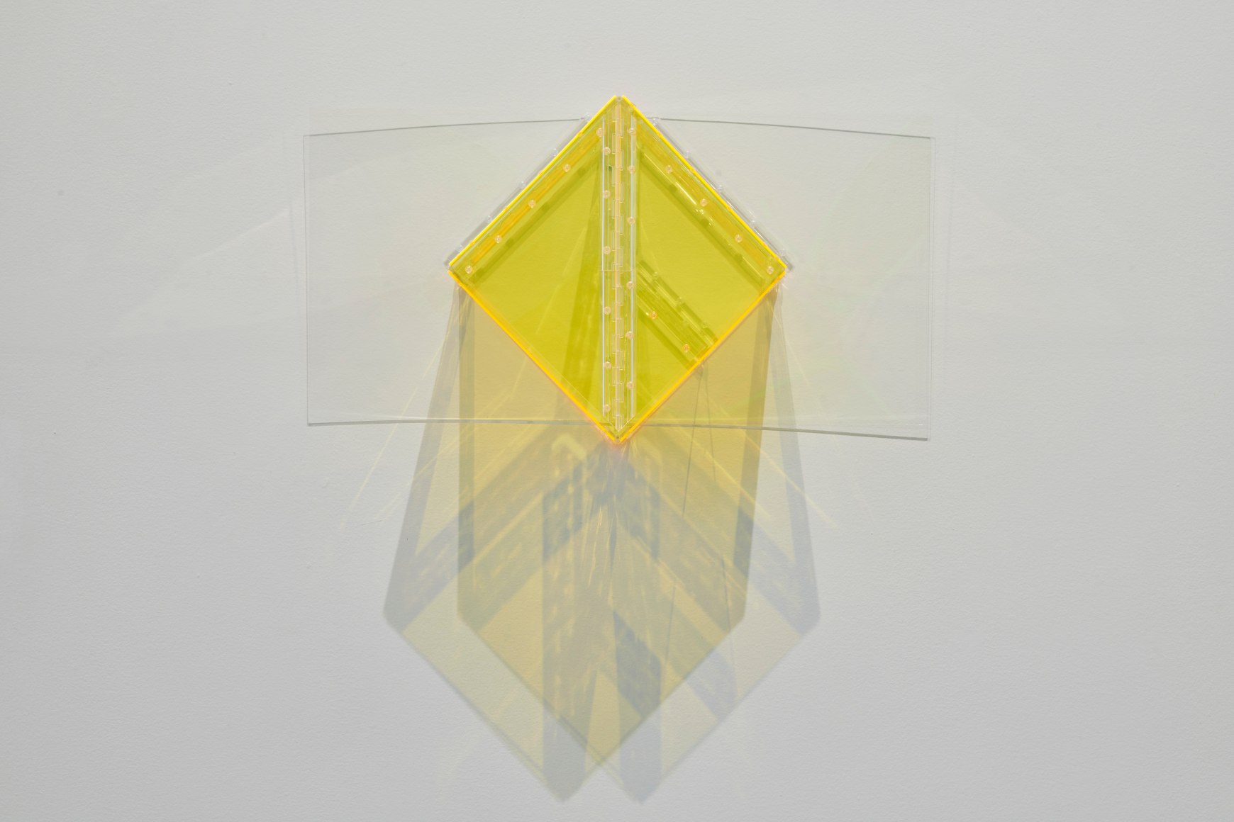 Marta Chilindron. Yellow Wall Cube, 2015, fluorescent yellow and clear acrylic and hinges, 15 x 31 x 11 in.